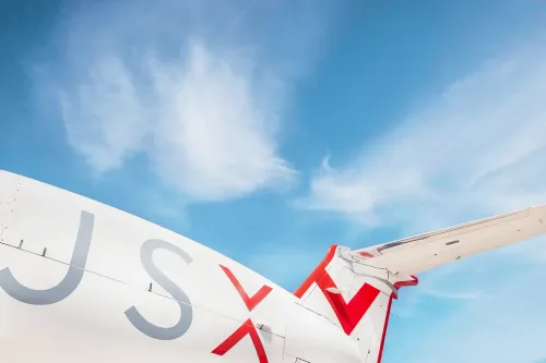 Wing and side decal of JSW logo on a JSX semi-private jet